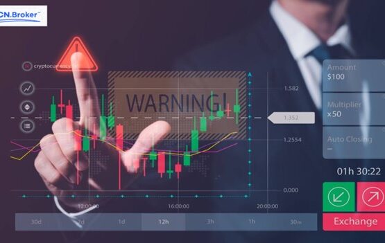 Person pointing at a financial chart with a 'Warning' sign, highlighting scam risks and issues with ECN.Broker.