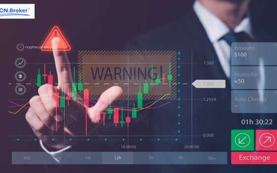 Person pointing at a financial chart with a 'Warning' sign, highlighting scam risks and issues with ECN.Broker.